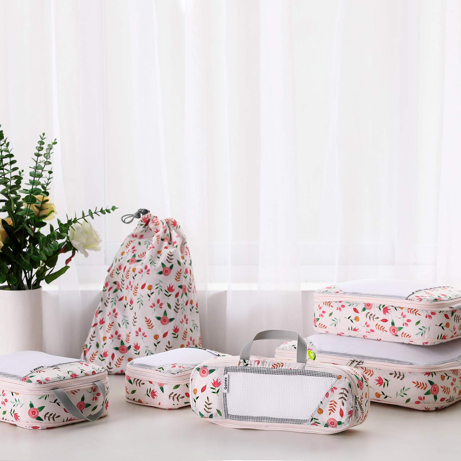 Cubos de embalaje de compresión con diseño floral de Gonex
