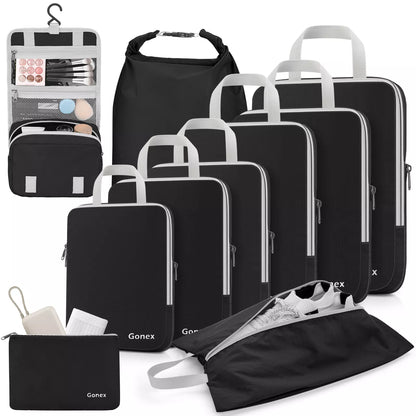 Set of black travel bags with various compartments and a makeup organizer